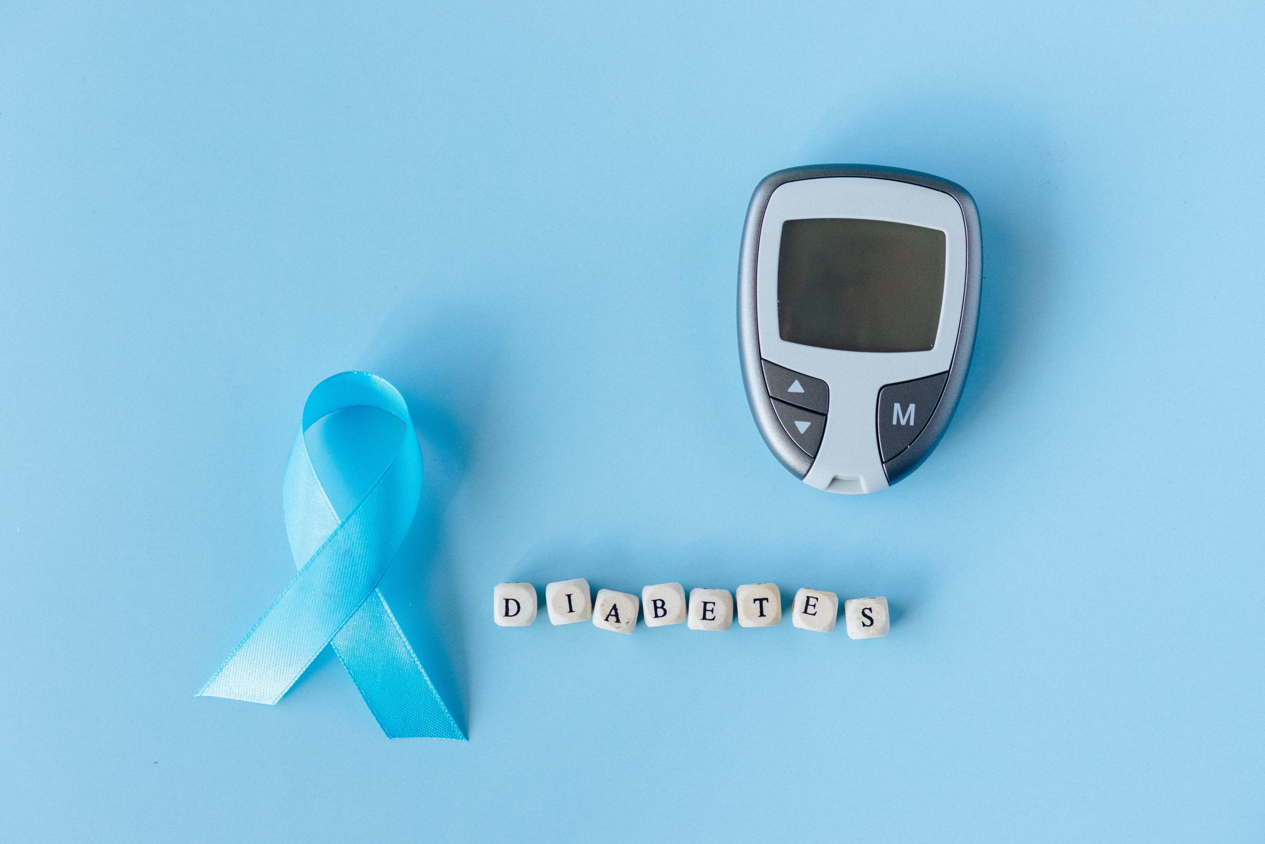 a picture of diabetes monitor and a ribbon