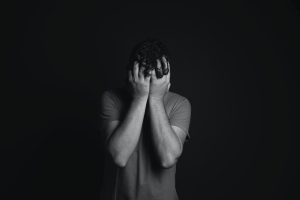 Photo-of-Man-Covering-Face-With-His-Hands