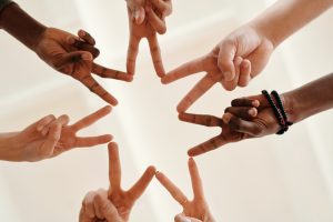 A-group-of-hands-form-a-star-shape-in-the-air-