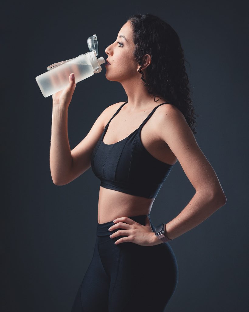 a-pretty-lady-drinking-water-after-a-workout