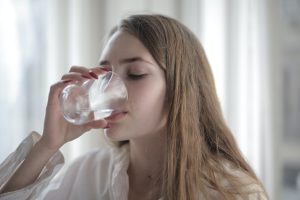 a-woman-drinking-a-glass-of-water