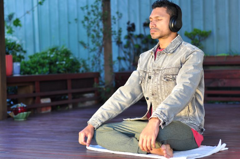 A-person-listening-to-a-guided-meditation-on-their-headphones