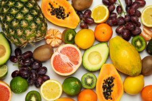 A vibrant assortment of fresh fruits showcasing their inner textures and colors