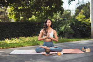 woman-meditating-in-a-park