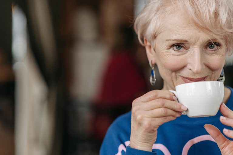 A senior woman enjoying a cup of tea