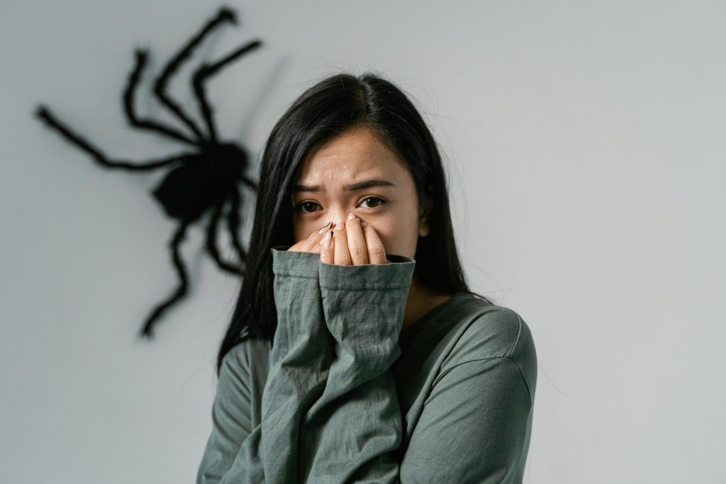 A Fearful Woman Having Arachnophobia