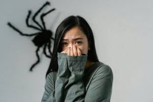 A Fearful Woman Having Arachnophobia