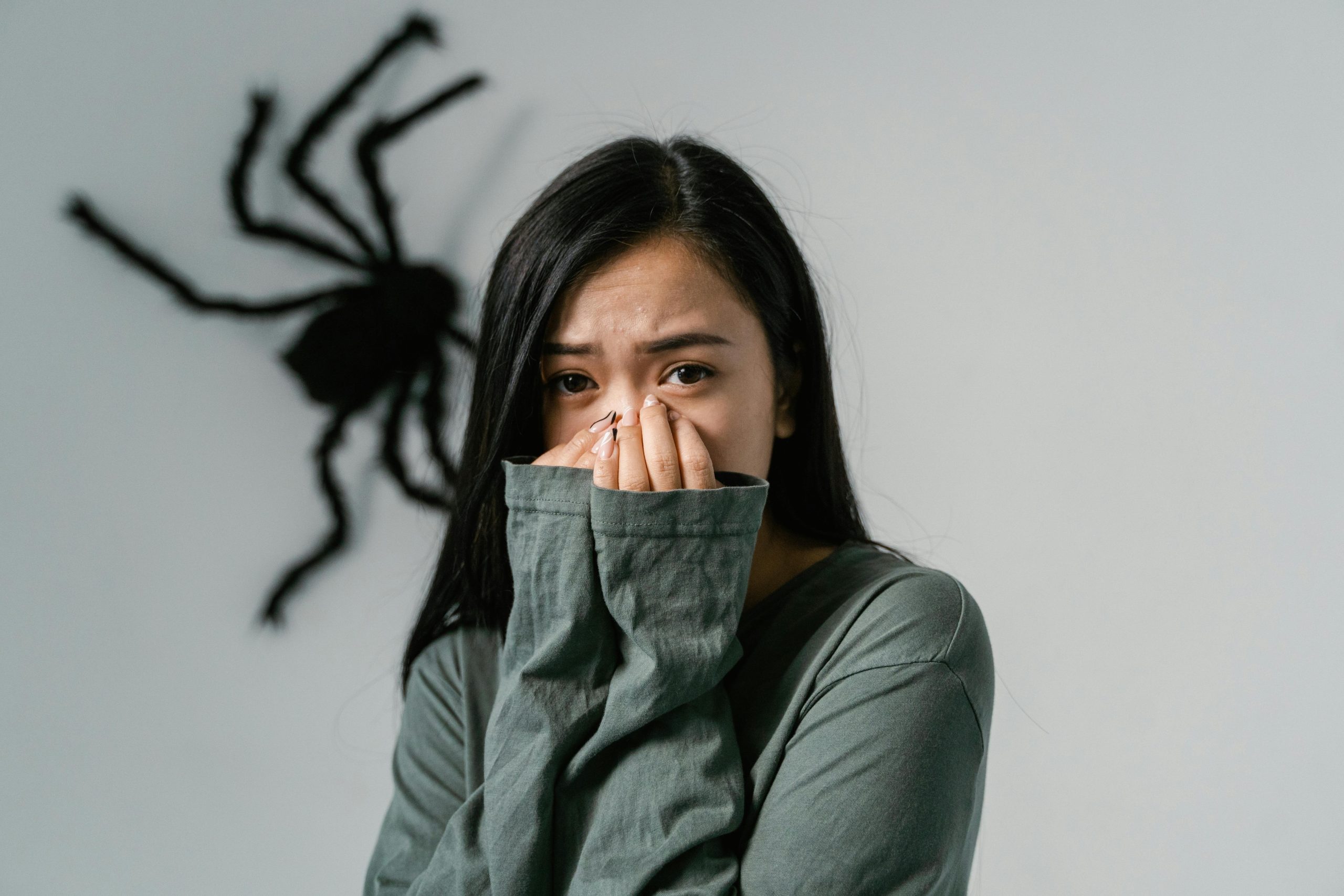 A Fearful Woman Having Arachnophobia