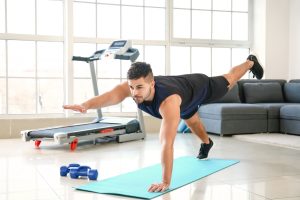 Sporty-young-man-training-at-home