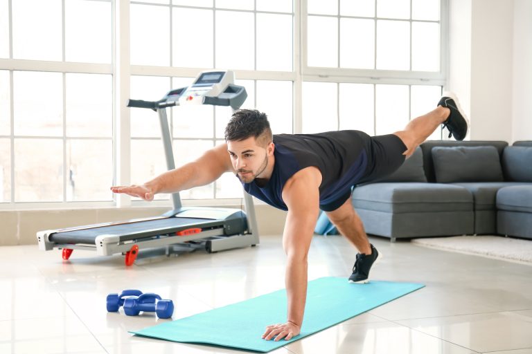 Sporty-young-man-training-at-home