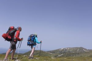 Summer-hiking-in-the-mountains-with-a-backpack-and-tent