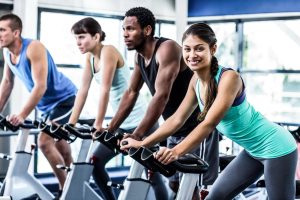 Fit-people-working-out-at-spinning-class