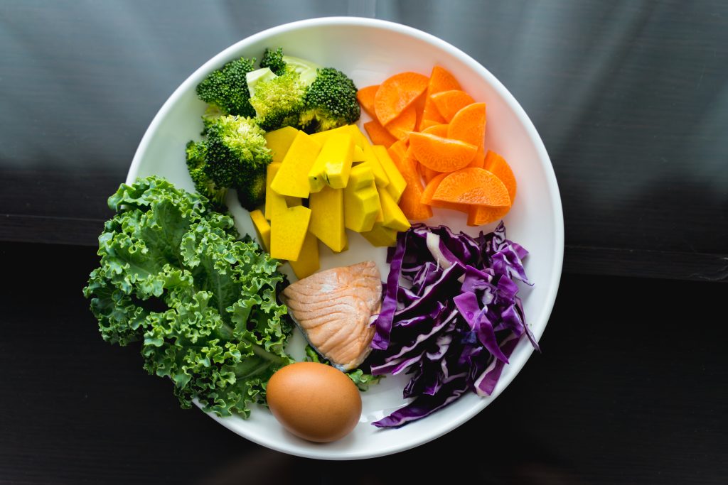 healthy-food-set-in-place-on-black-table-top-view