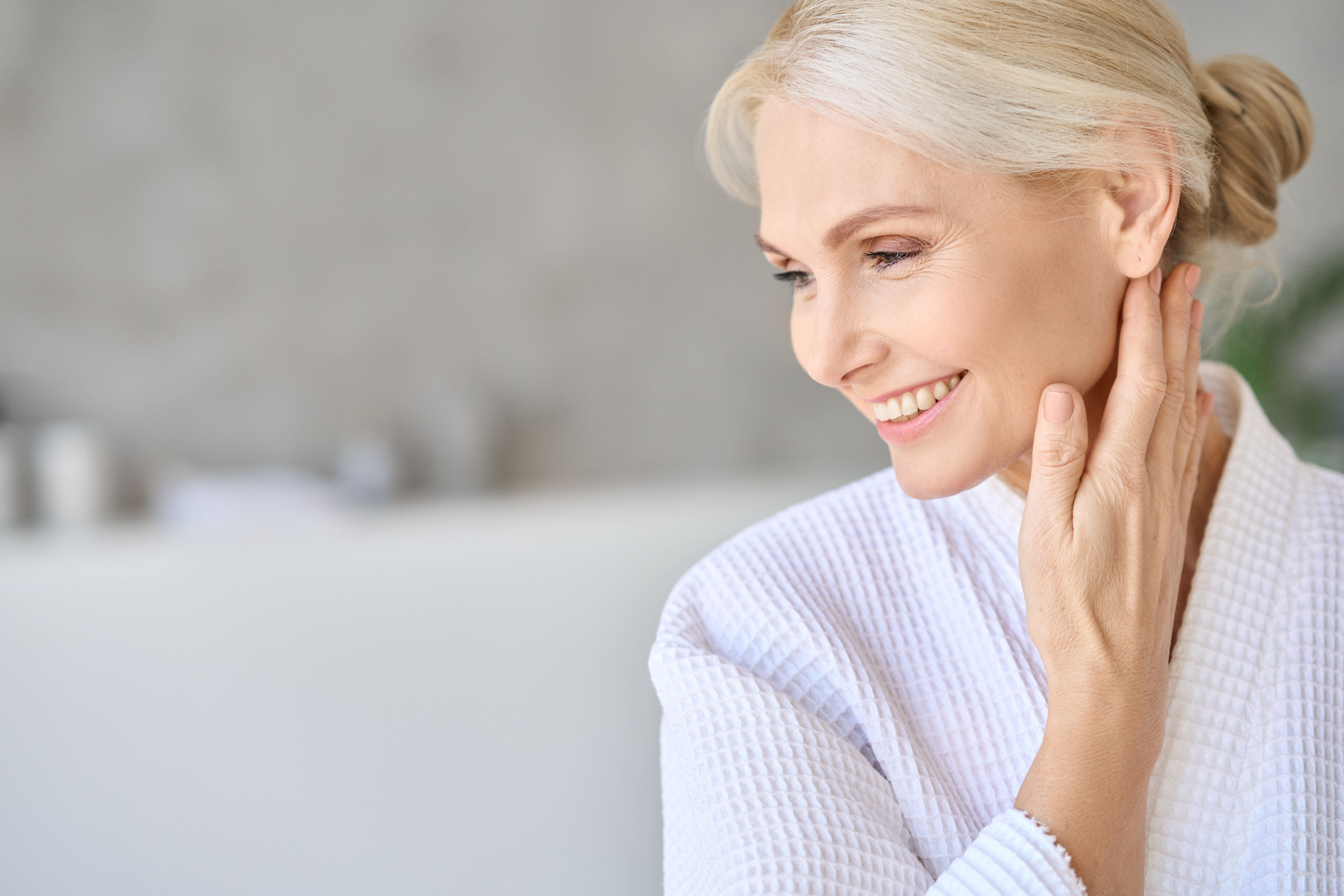 happy-smiling-mid-age-woman-looking-away-copy-spa