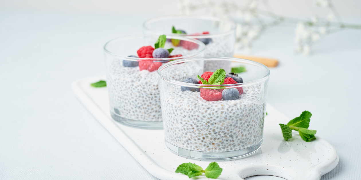 Banner with chia pudding with fresh berries raspberries, blueberries.