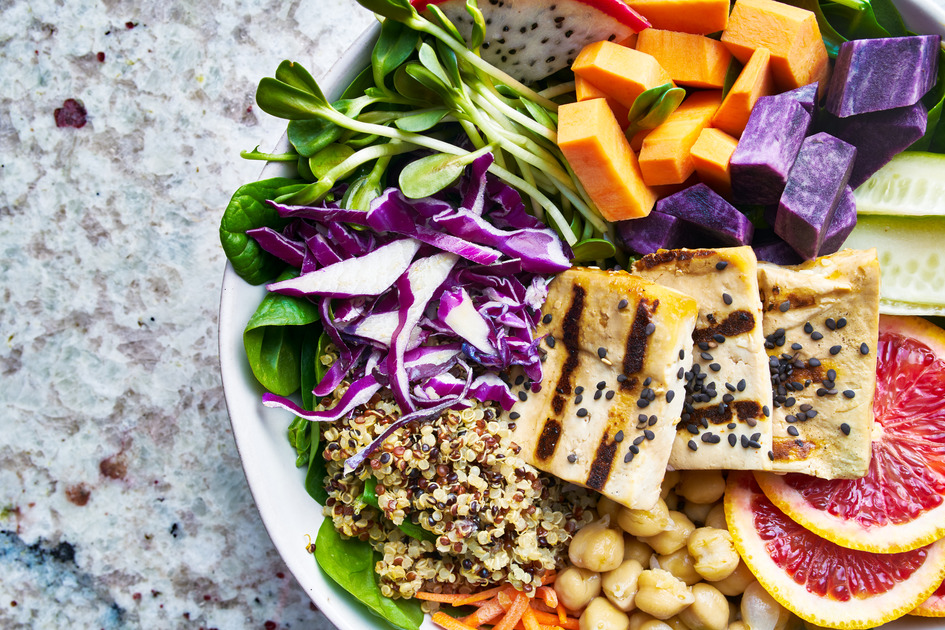 colorful buddha bowl close up with grilled tofu