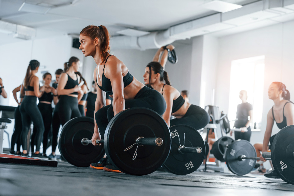 lifting-barbell-group-of-young-sportive-people-ha-2025-03-18-20-21-51-utc