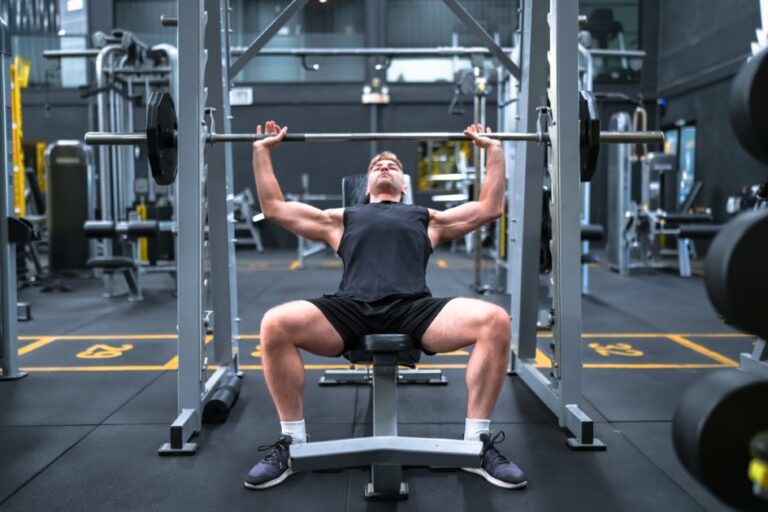 Young man training in a fitness club