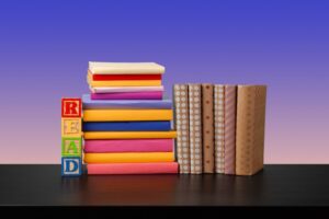 Stack-of-books-on-black-wooden-table