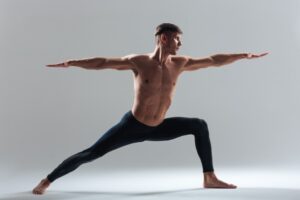 Full-length-portrait-of-a-man-doing-yoga-exercises