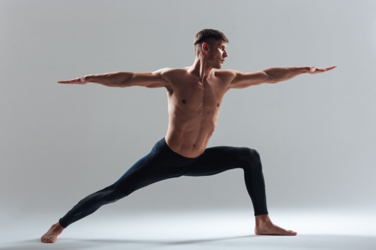 Full-length-portrait-of-a-man-doing-yoga-exercises