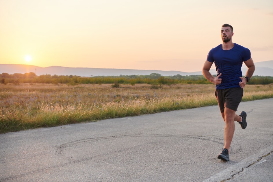 Man Running at Sunset in Rural Area