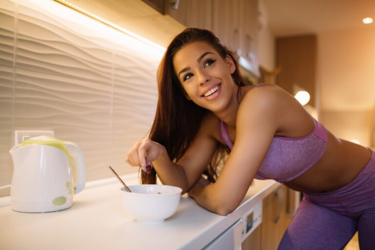 Woman Enjoys Healthy Breakfast in Kitchen
