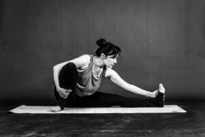 Adult performing a static stretching flexibility exercise