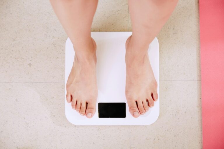 a-person-standing-on-wight-scale