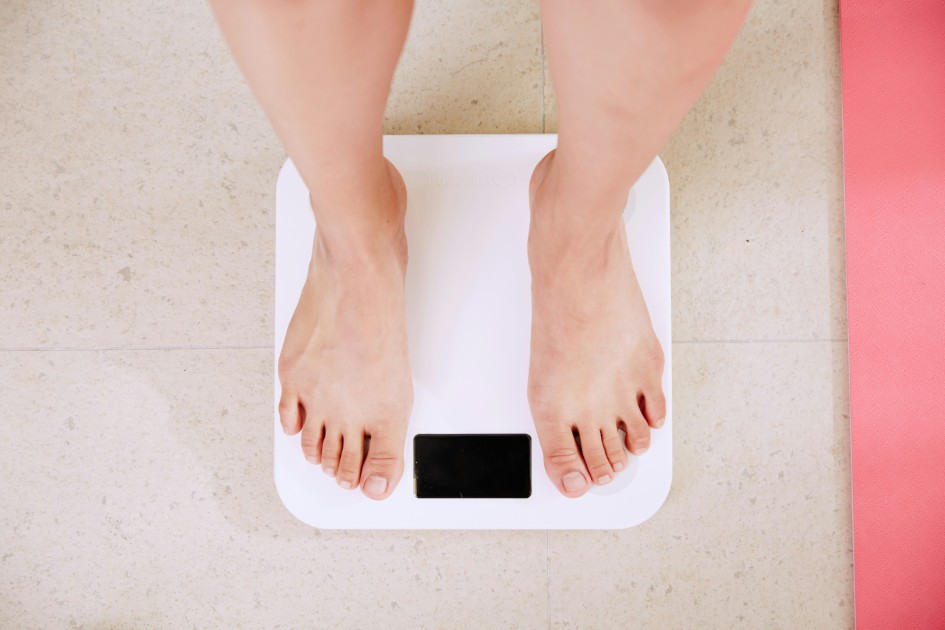 a-person-standing-on-wight-scale