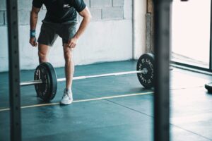 Older adult performing a controlled barbell squat