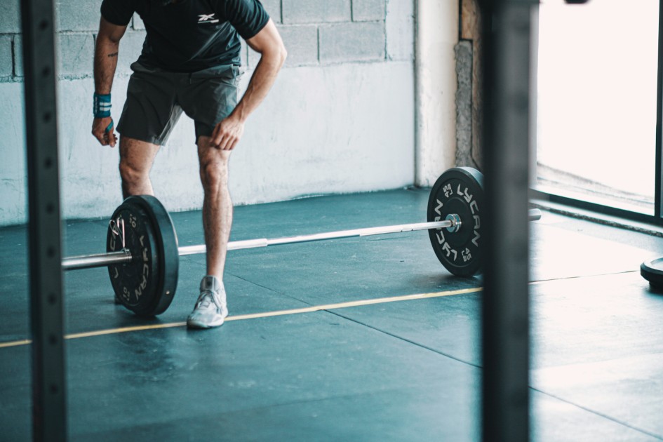 Older adult performing a controlled barbell squat